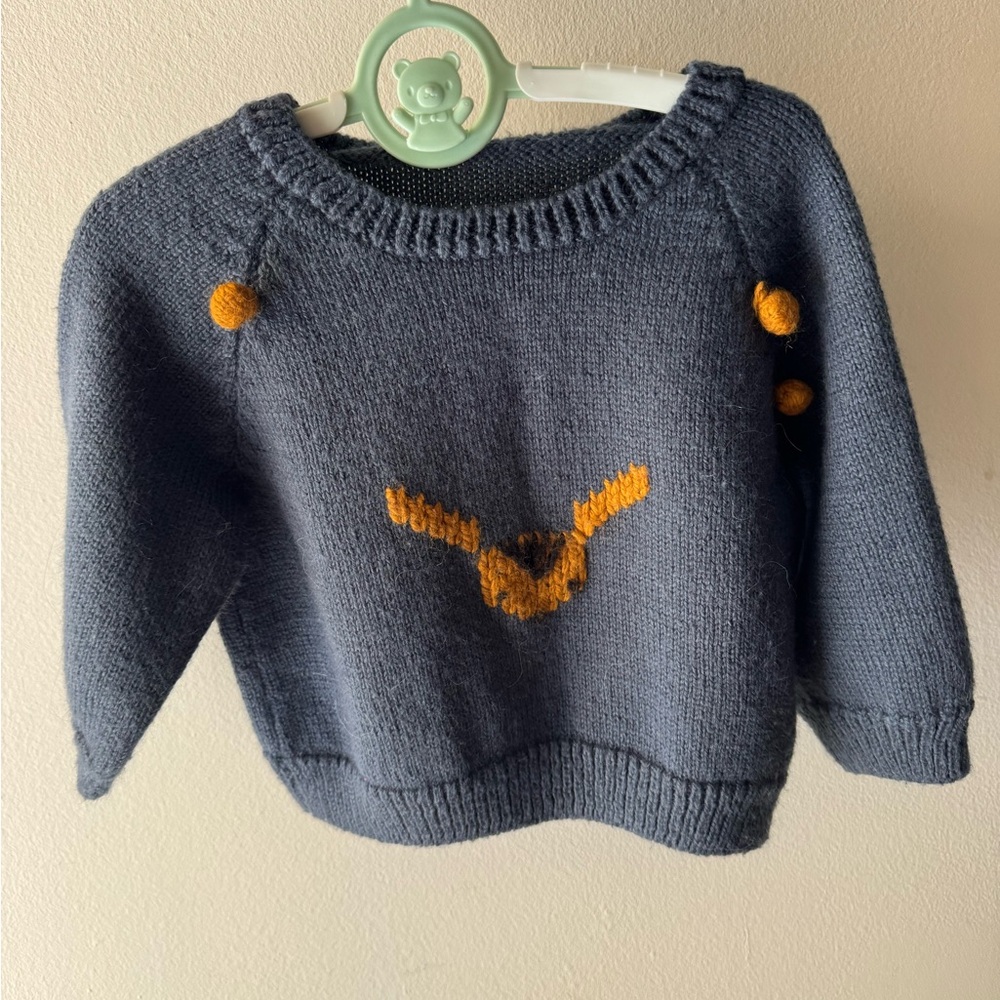 Argentinian Wool Blue Sweater with ocre hand embroidered Accents